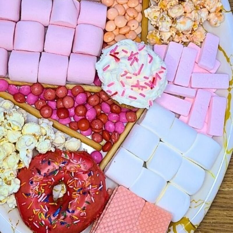 Valentine’s Sweet Treats Board with candy and strawberries